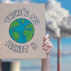 Climate change manifestation poster "There is no planet b" on an industrial fossil fuel burning