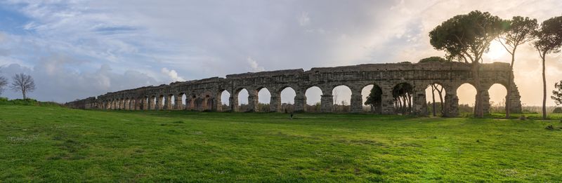 A photo of ruins of the Roman aqueduct Aqua Claudia in Parco degli Acquedotti park, Rome, Italy.