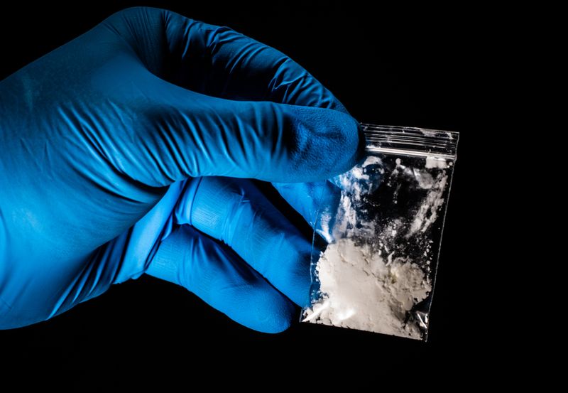 A bag of heroin fentanyl drugs in the hands of a doctor.