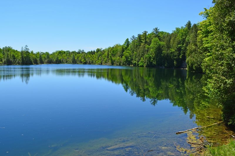 Crawford Lake, a rare meromictic lake (where layers don't mix), has the dubious honor of being proposed as the place that indicates the start of the Anthropocene thanks to its plutonium levels from nuclear testing carried out here in the 1950s.