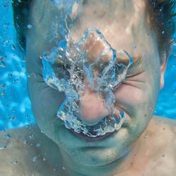 Man crying under water. 