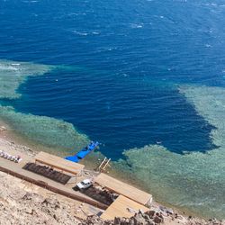 Blue Hole is a popular diving location on east Sinai, a few kilometres north of Dahab, Egypt on the coast of the Red Sea.