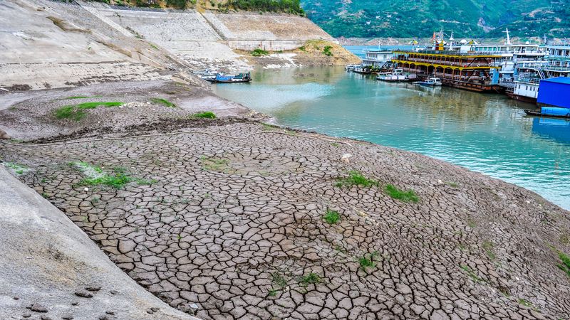 Dry and cracked land on the Yangtze River bed. Image Credit: xinjian/Shutterstock.com