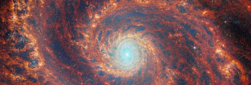 A composite image of the glorious "grand design" spiral galaxy M51, also known as the Whirlpool galaxy, by JWST’s NIRcam and MIRI instruments.