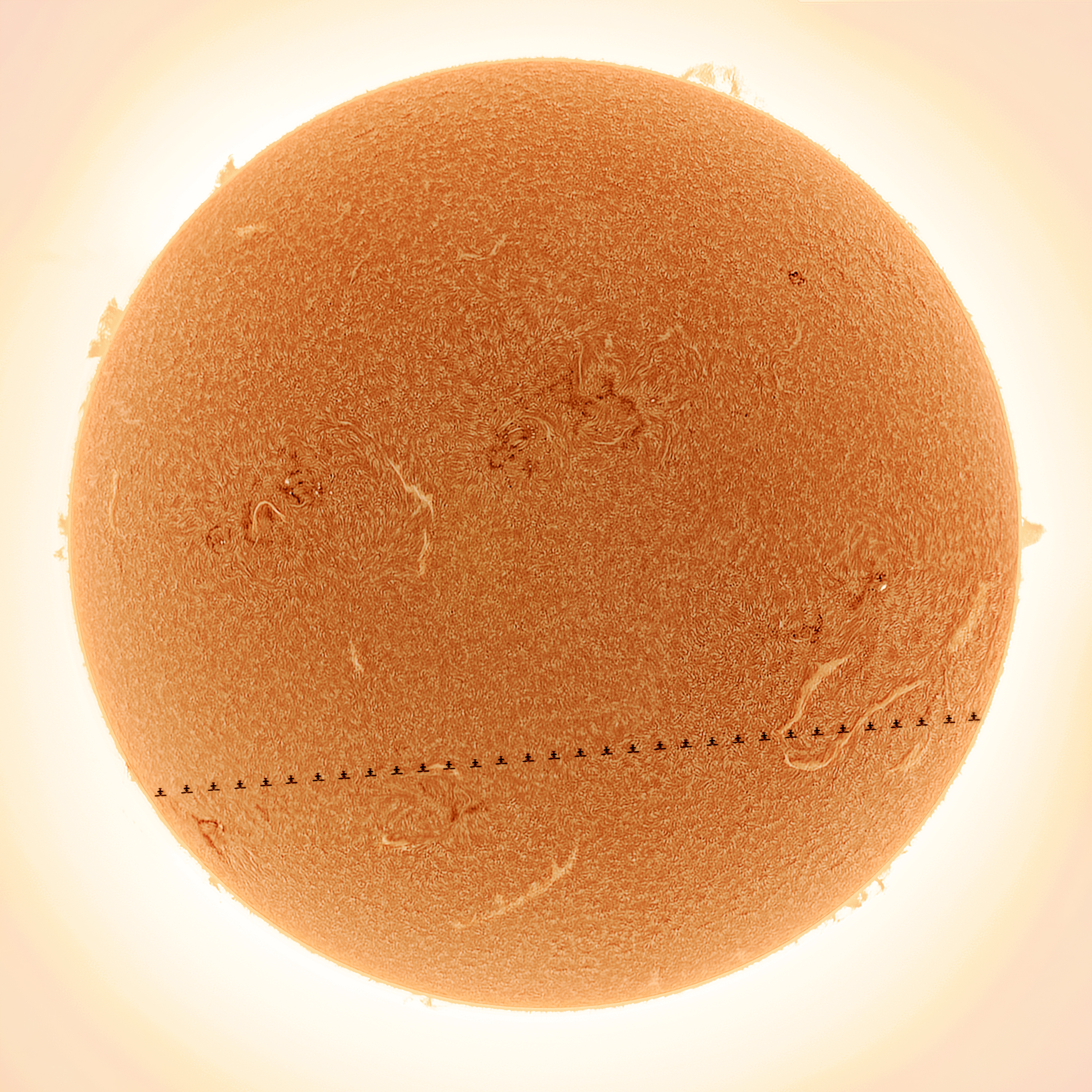 China Space Station Transits Active Sun - The Sun photographed showing the transit of the China Space Station (CSS). The image of the CSS was produced by selecting the nine clearest photos from captured video frames.