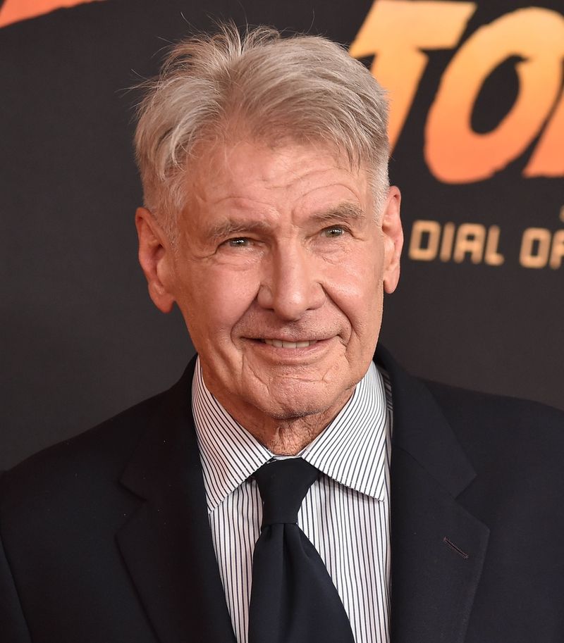 Photograph of Harrison Ford in a suit, from the chest up