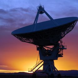 Radio telescope at sunset