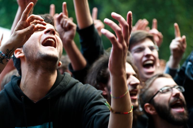 unidentified group of people cheer during the Mi Ami music festival in Milan 