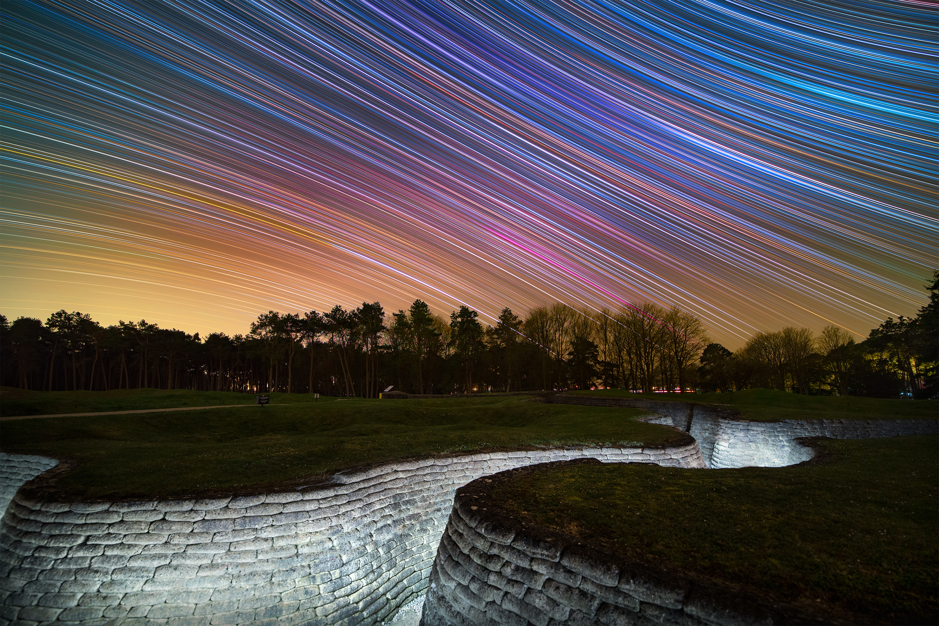 Star trails above the preserved First World War trenches in Canadian National Vimy Memorial Park, Northern France. Taken over five hours, the camera captured the rotation of the sky revealing the colourful stars.  