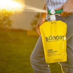 Person outside spraying from a yellow bag labelled 'Sunday'.