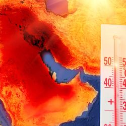 Thermometer with a record high temperature of fifty degrees Celsius, against the backdrop of the Arabian Peninsula