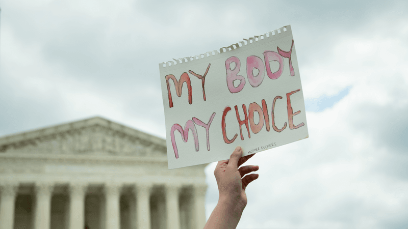 A protest sign reading "my body my choice"