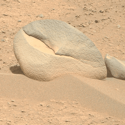 Two rocks on Mars, looking a bit like a crab claw and a shark fin.