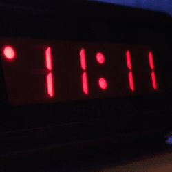 The time "11:11" on a digital clock.