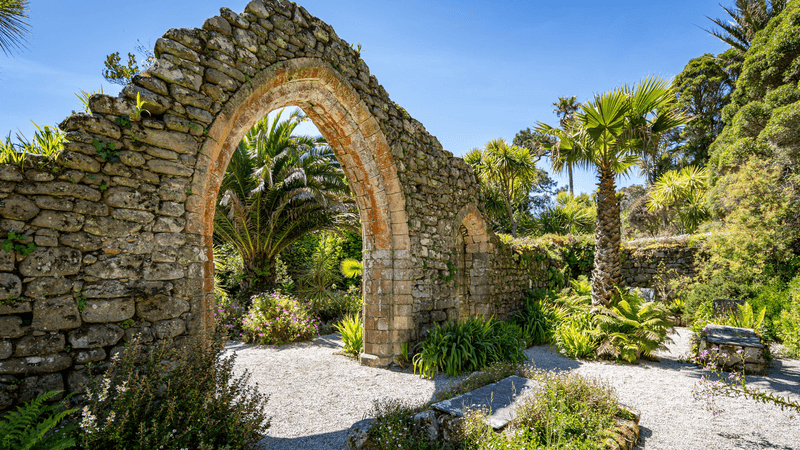 The ruined archway of the old Abbey on Tresco, Isles of Scilly, Cornwall.