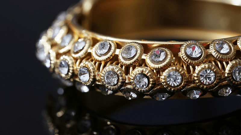Gold Bracelet with lots of diamonds 
