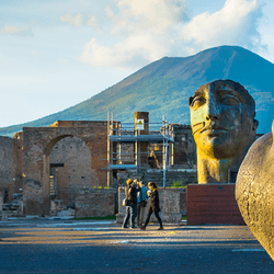 Pompeii, with large head statues in view.